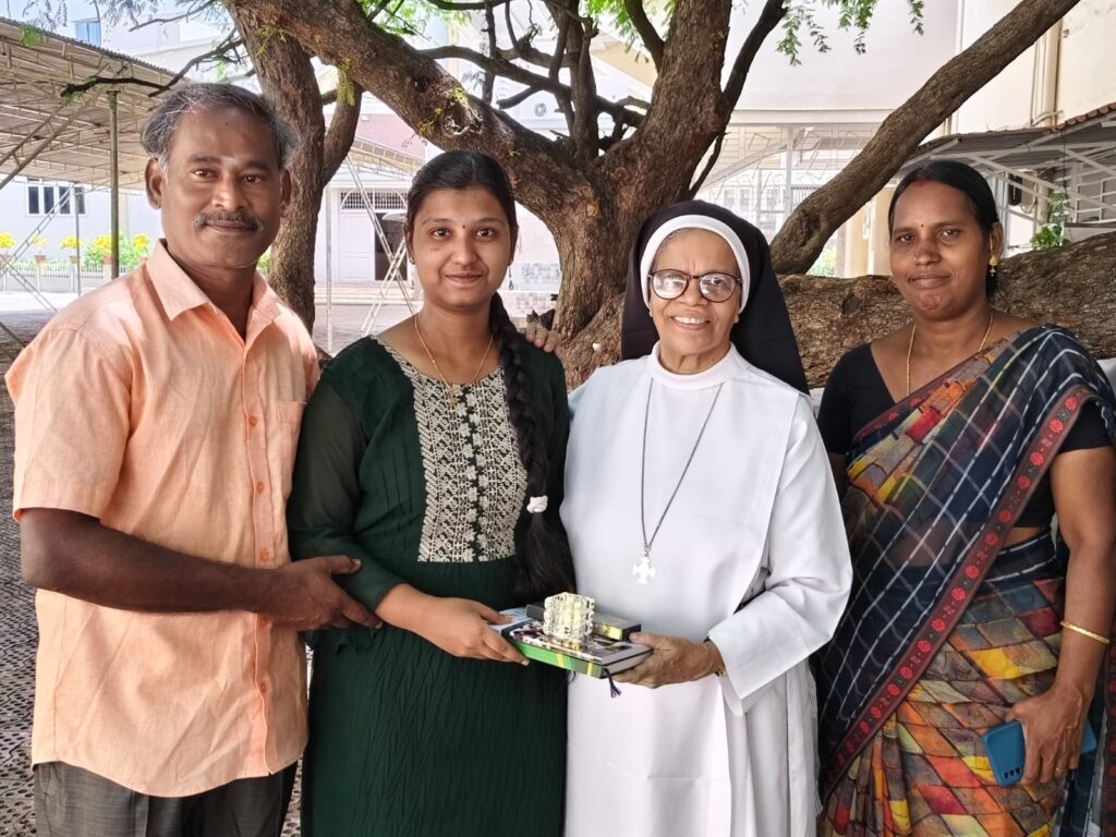 Congratulating the School Topper of Std XII:
